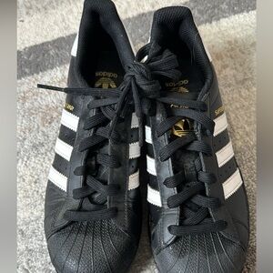 Black-and-white Adidas superstar